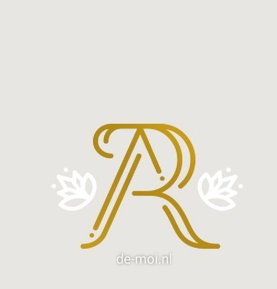 the letter r is made up of gold and white letters, with leaves on each side