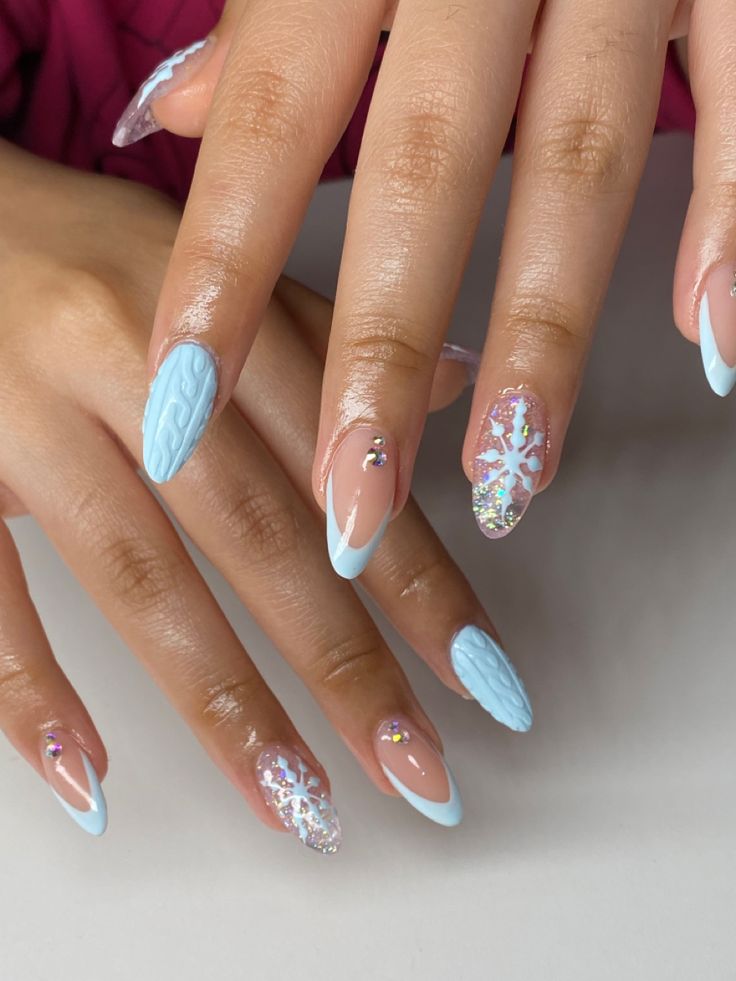 Winter Nails Baby Blue, Baby Blue Nails Christmas, Light Blue And White Christmas Nails, Baby Blue Nails With Snowflakes, Short Blue Christmas Nails, Baby Blue Christmas Nails Almond, Cute Blue Winter Nails, Sweater Nails Almond Shape, Blue And White Nails Christmas