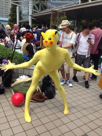 a person in a pikachu costume is playing with a ball