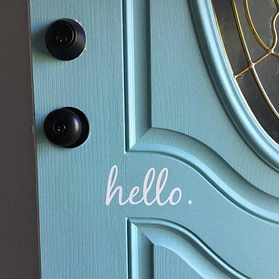 a blue door with the word hello painted on it