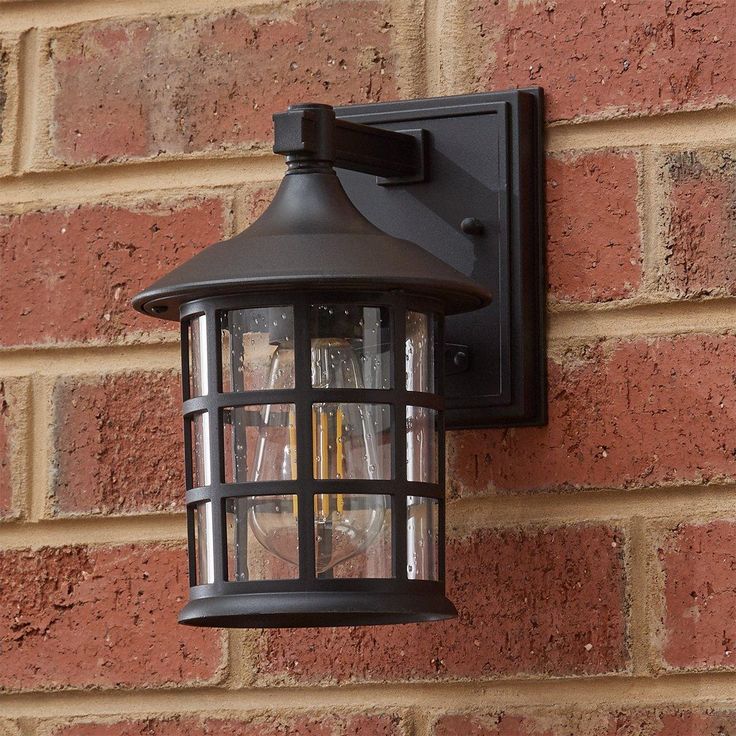 a brick wall with a light attached to it