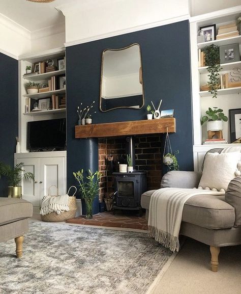 a living room filled with furniture and a fire place