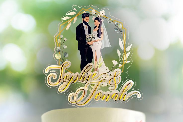 a wedding cake topper with an image of a bride and groom in the middle