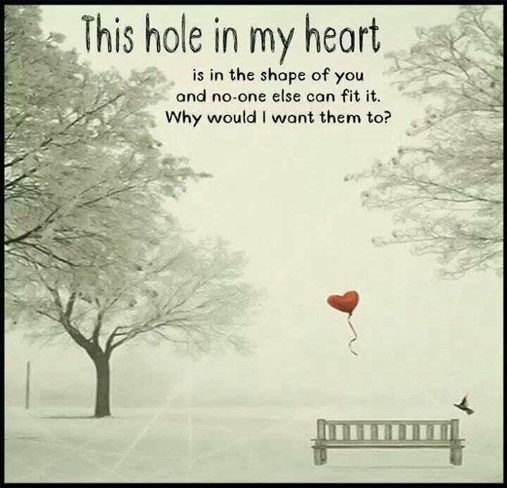 an image of a bench in the snow with a heart shaped balloon attached to it