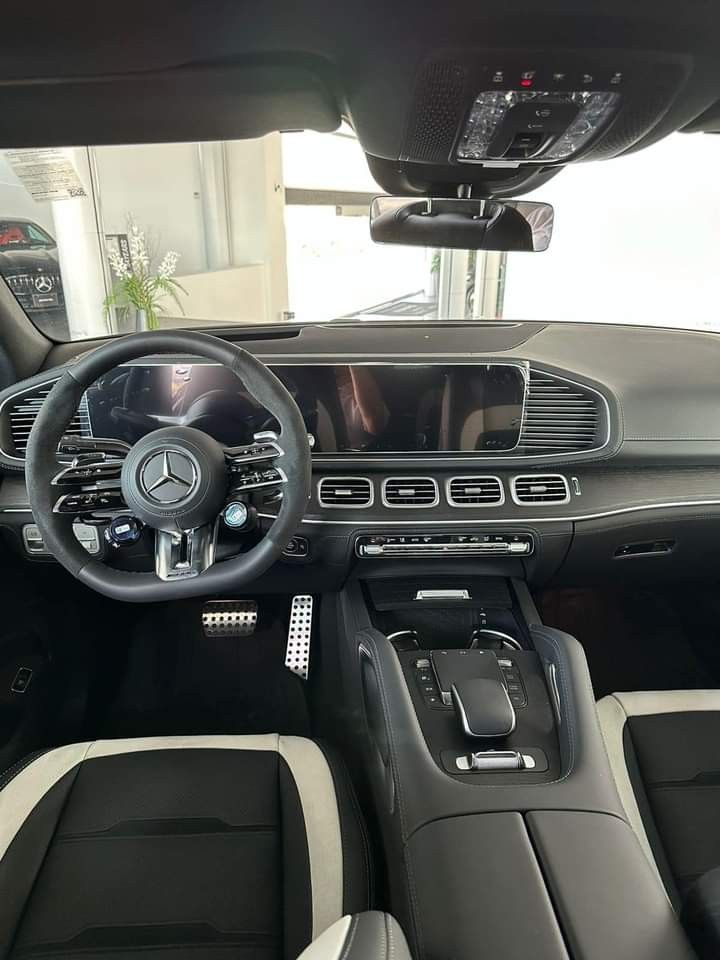 the interior of a car with black leather seats