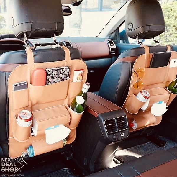 two backseat back seats with bottles and drinks in them on the side of a car