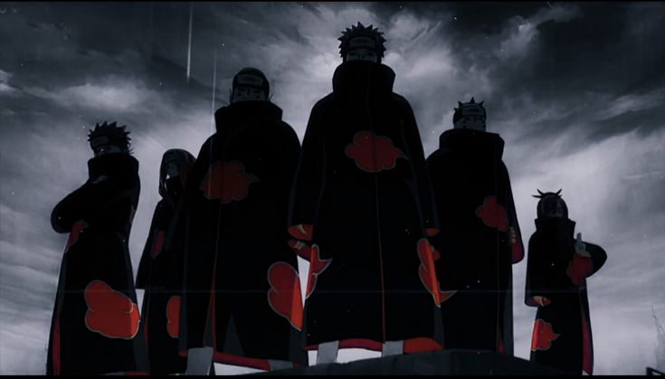 the silhouettes of three people in black and red outfits stand against a cloudy sky