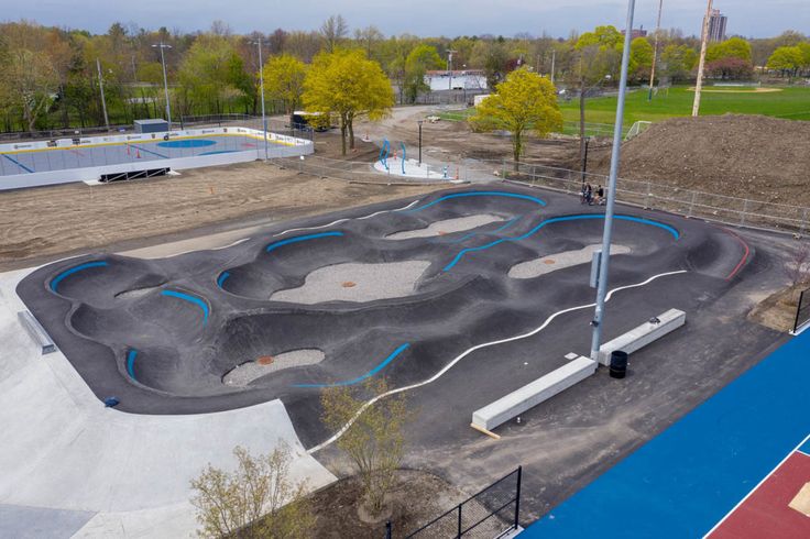 an aerial view of a skate park with ramps