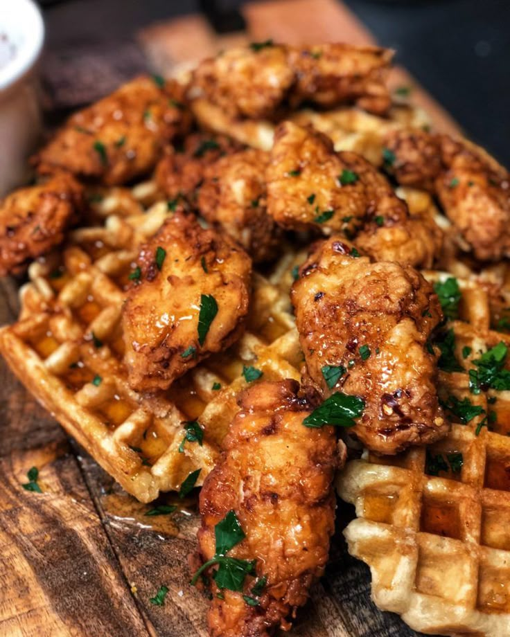 fried chicken and waffles on a wooden table