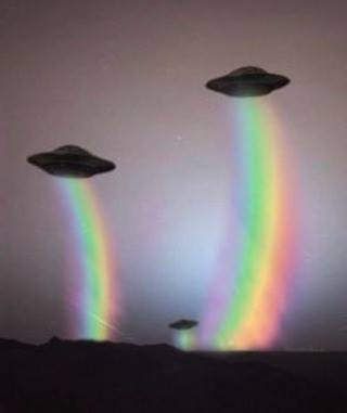 three flying saucers in the sky with a rainbow colored light coming from one side