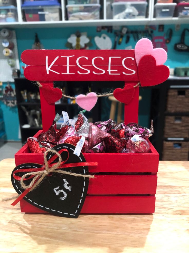 a valentine's day gift box filled with chocolates and hearts for kisses