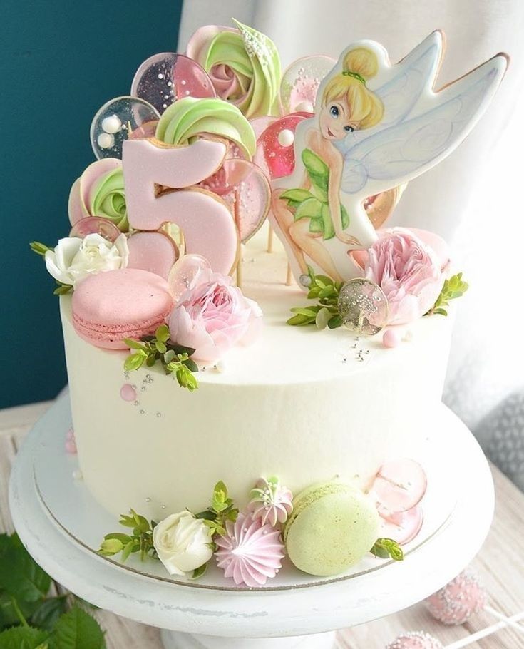 a decorated cake sitting on top of a table