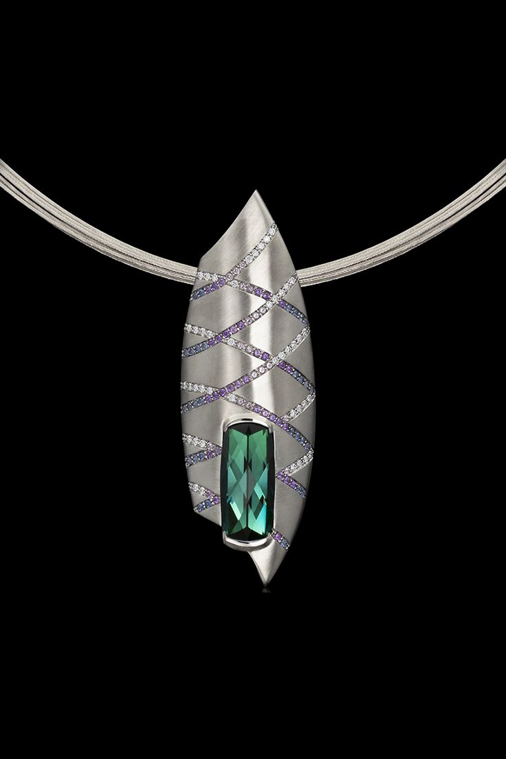 Treillis pendant displays a sumptuous green tourmaline, cut by master lapidary Stephen Avery. This dramatic pendant in white gold is accented with colorful gradient of blue sapphires, amethyst, and diamonds. To complete the piece, it is suspended from a 10-strand white gold chain. Gala Jewelry, Award Winning Jewelry, Modern Jewellery Design, Colorful Gradient, Sparkle Necklace, Tourmaline Pendant, Tourmaline Jewelry, Amethyst Jewelry, Couture Jewelry