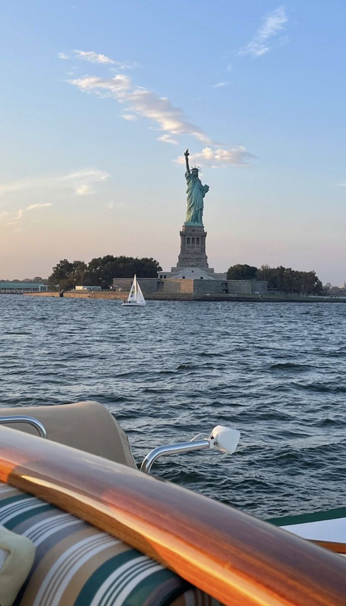 the statue of liberty is seen from across the water