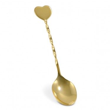 a gold spoon with a heart on it