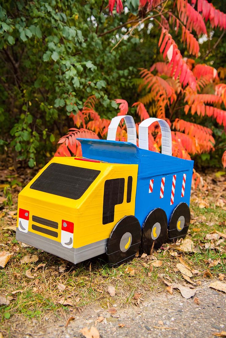 a toy truck is sitting in the grass