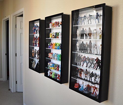 three black framed shelves filled with action figures