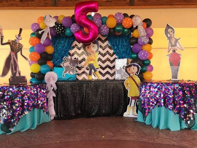 an image of a birthday party with balloons and decorations on the table in front of it