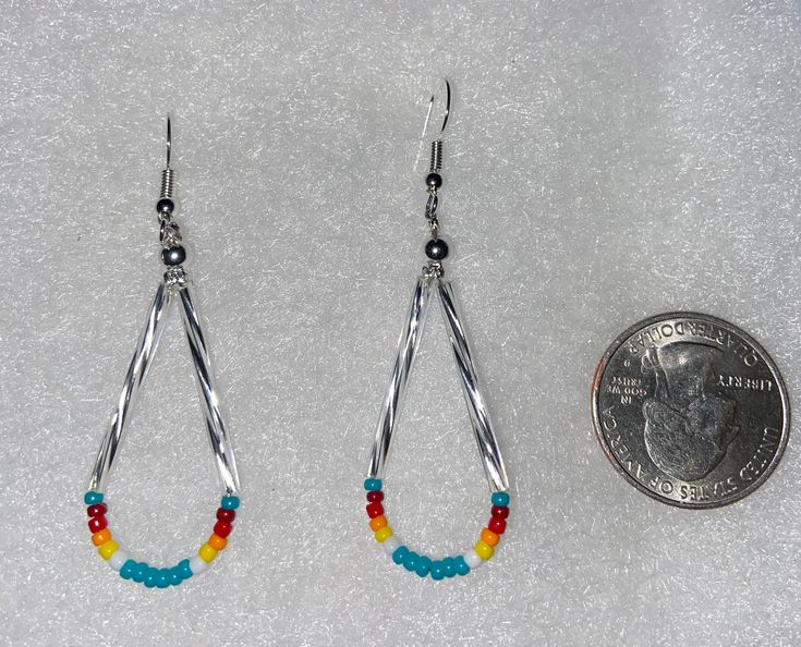 These beautiful Native earrings are made out of seed beaded and bugle glass. Got about 6 different colors. If you have any question just message us. Thanks for looking at our page. We also have some clearance items or raffles on are Facebook group pages. Come check us out at Cassy's Native Selling & Auctions or Cassy's Native Beadwork & Apparels. Beaded Medallion Native American, Bead Earring Ideas, Native American Beadwork Earrings, Beaded Tutorials, Native Humor, Indigenous Beadwork, Easy Beading, Kitchen Decor Sets, Beaded Items