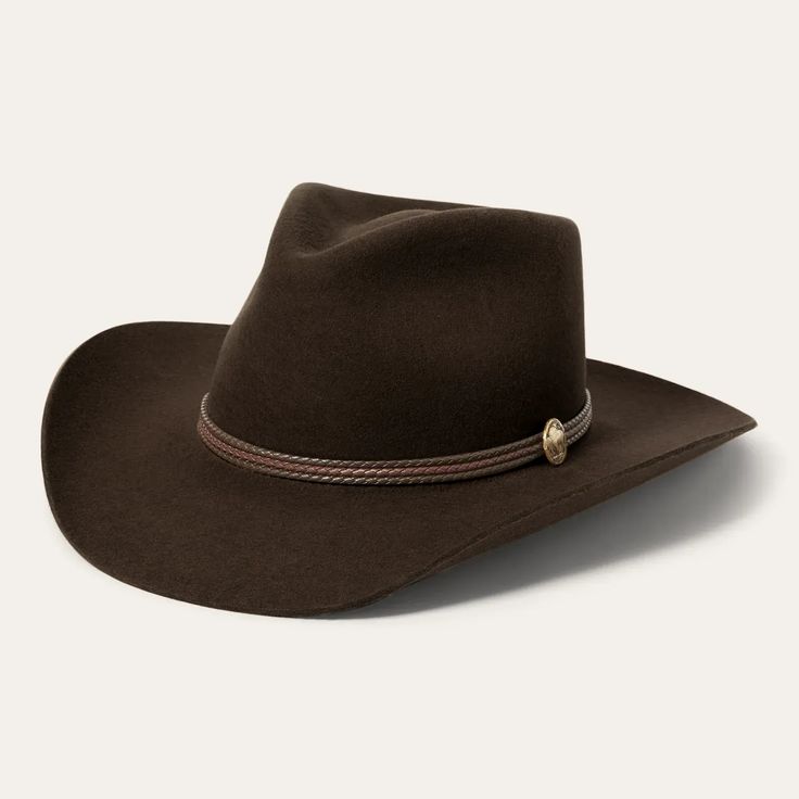 Its exceptional quality and Beth Dutton inspired design define this hat, made from premium materials to provide style and elegance, perfect for every good cowboy who loves the Yellowstone collection!Beth Dutton's exclusive Western Hats are handcrafted from high quality 100% wool felt for a sturdy finish and unique style. It has a 4 1/4-inch pinch crown, 3 1/4-inch brim, and a three-cord braided leather hatband with buffalo nickel pins. Full satin lining provides luxurious comfort, and absorbent DRI-LEX® sweatband provides a cool, secure fit.100% Wool Felt4 1/4” Pinch Front Crown3 1/4” Brim3-Cord Braided Leather HatbandBuffalo Nickel PinDRI-LEX® Absorbent SweatbandSatin LinerFirm FinishHandmade in the U.S.A.The size of the hat is based on the circumference of the head. In order to determine Elegant Brown Hat Band For Ranch, Classic Brown Felt Hat For Rodeo, Western Wool Hat For Western-themed Events, Elegant Brown Hat Bands For Rodeo, Classic Brown Western Fedora, Western Brown Felt Hat, Western Wool Hat Bands For Rodeo, Classic Brown Fedora For Western-themed Events, Western Style Brown Felt Hat