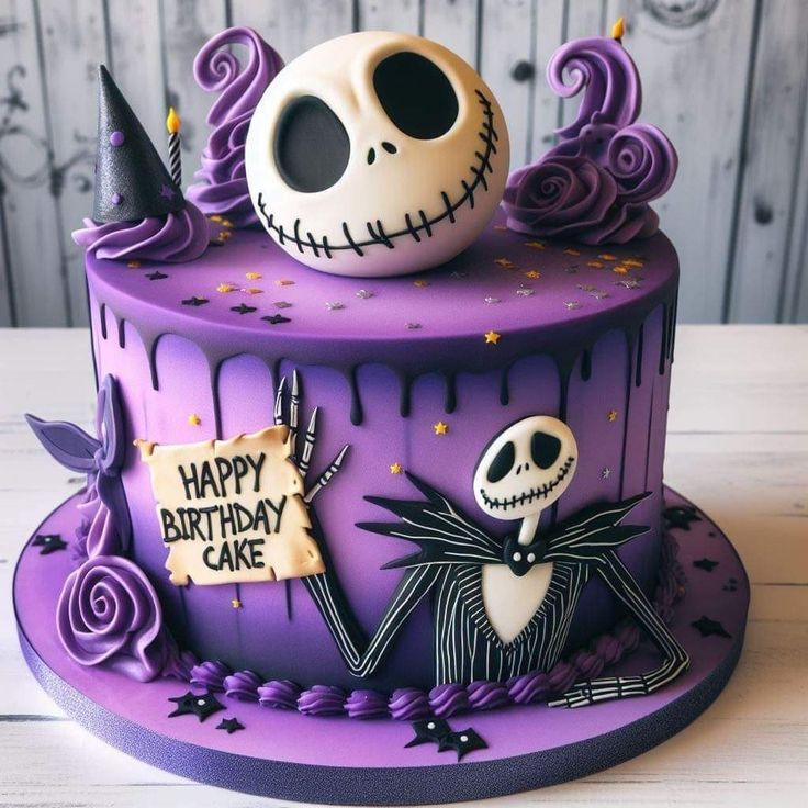 a birthday cake decorated with purple icing and spooky decorations