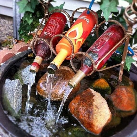 wine bottle fountain with water running out of it