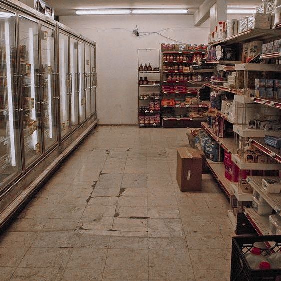 an empty grocery store filled with lots of food