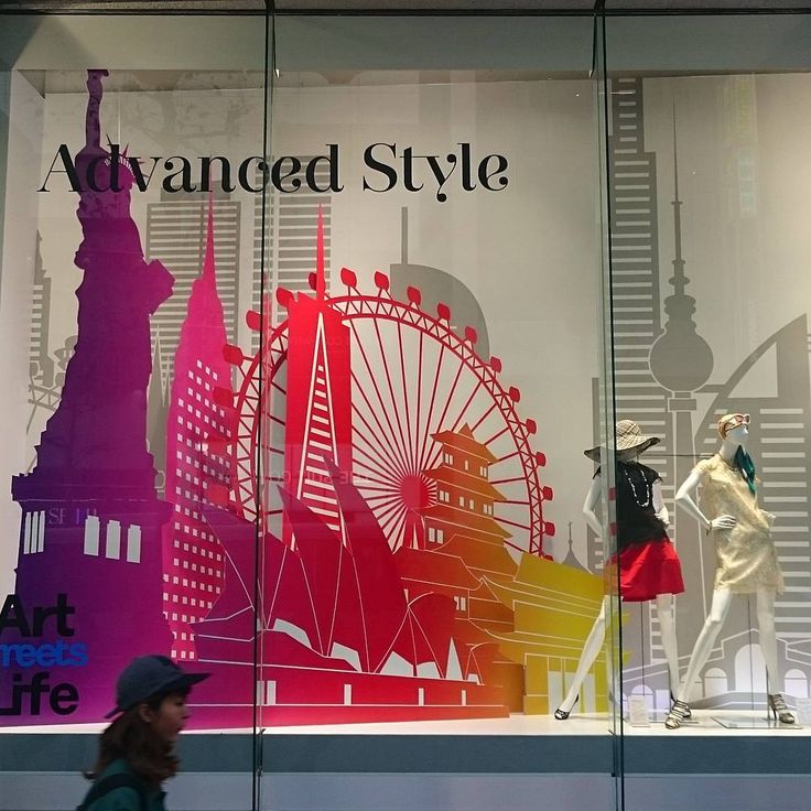 a window display with mannequins dressed in colorful outfits and the words advanced style