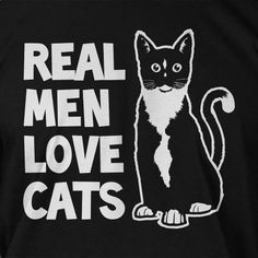 a black t - shirt with a cat on it that says real men love cats