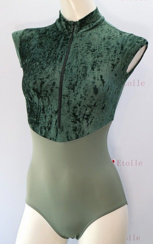 a mannequin wearing a green bodysuit with zippers on the front and side