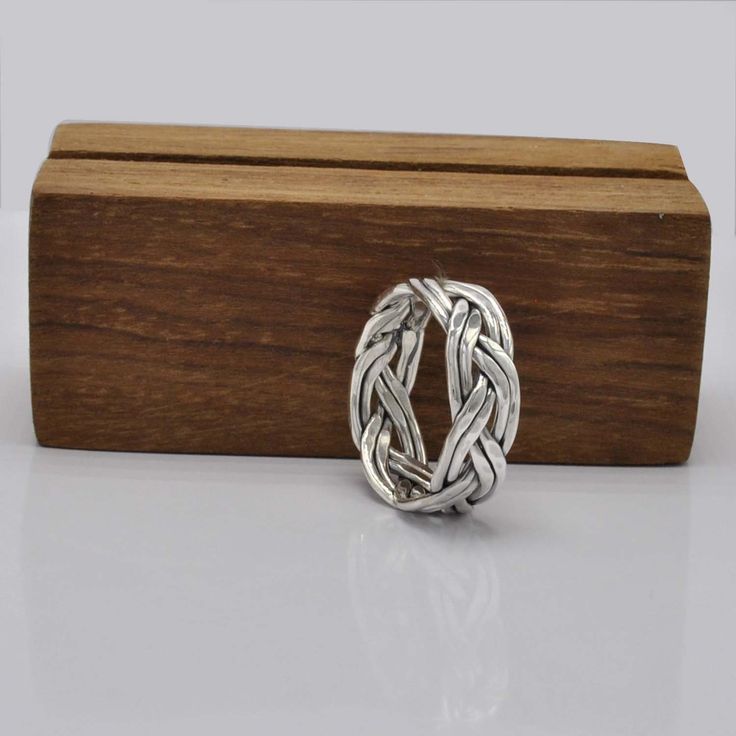 Double Braid Silver Ring - 925 Sterling Silver Celtic Band Ring - Size 10 Meditation Ring - Unisex Gift for Him or Her Description: Celebrate timeless craftsmanship with this Double Braid Silver Ring. Handcrafted from premium 925 Sterling Silver, this Celtic-inspired band features two intricately braided designs woven together, symbolizing unity and strength. Its minimalist yet elegant look makes it the perfect choice for both men and women, whether worn as a statement piece or for meditation. T Braided Designs, Celtic Band, Double Braid, Meditation Ring, Ring Men, Meditation Rings, Gift Ring, Unisex Gifts, Size 10 Rings