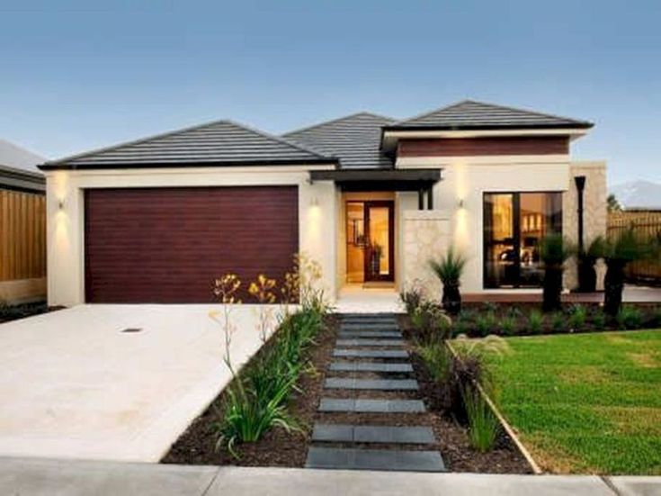 a modern house with landscaping in the front yard