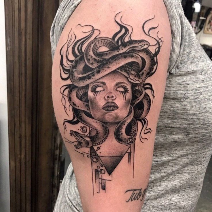 a woman with a snake on her head and an octopus around her neck is depicted in this tattoo design