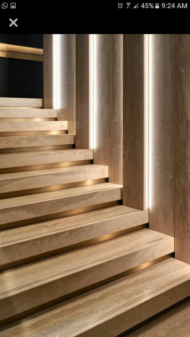 the stairs are made of wood and have lights on them