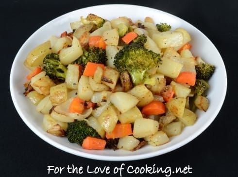 a white bowl filled with cooked vegetables on top of a black tablecloth and the words for the love of cooking net above it