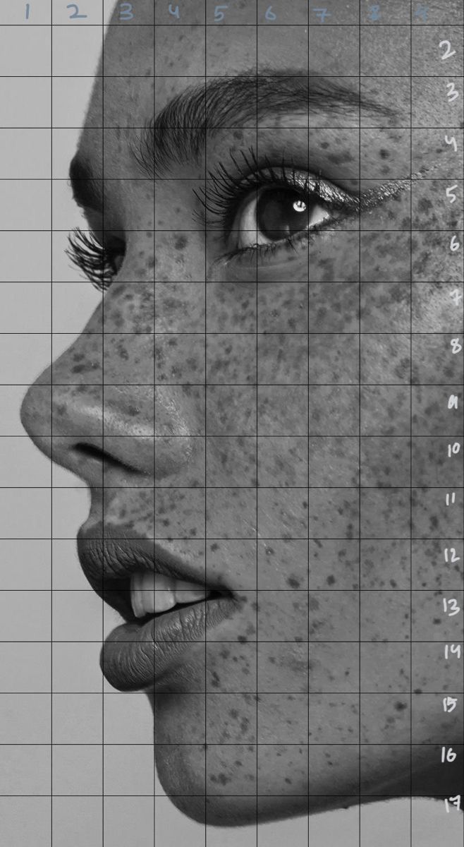 a woman with freckles on her face is shown in front of a grid