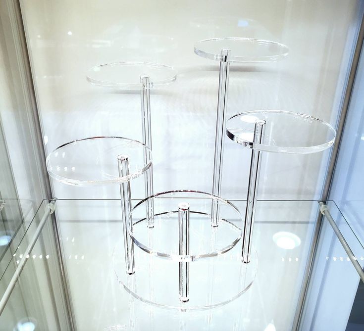 three tiered glass display case in a store