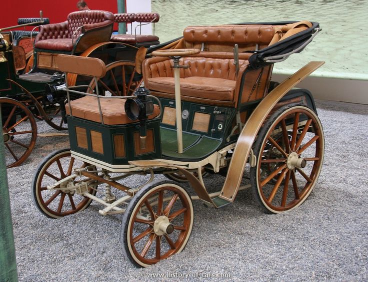 an old fashioned car is on display at the museum