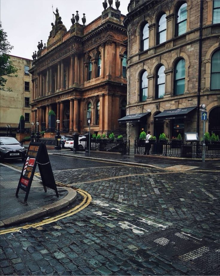 an empty street in front of some old buildings