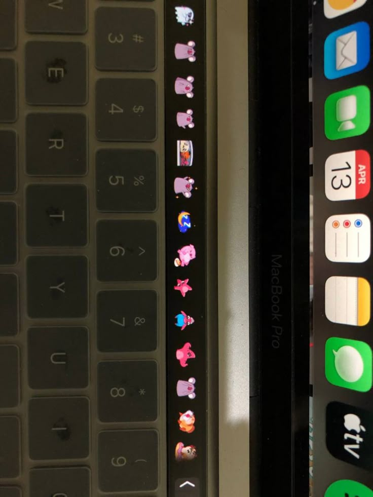 two different types of cell phones sitting next to each other on a table with buttons