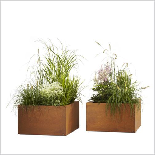 two wooden planters with plants in them