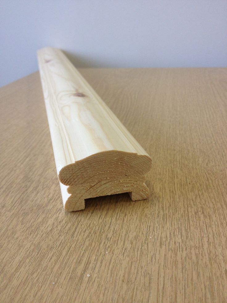 a piece of wood sitting on top of a wooden table