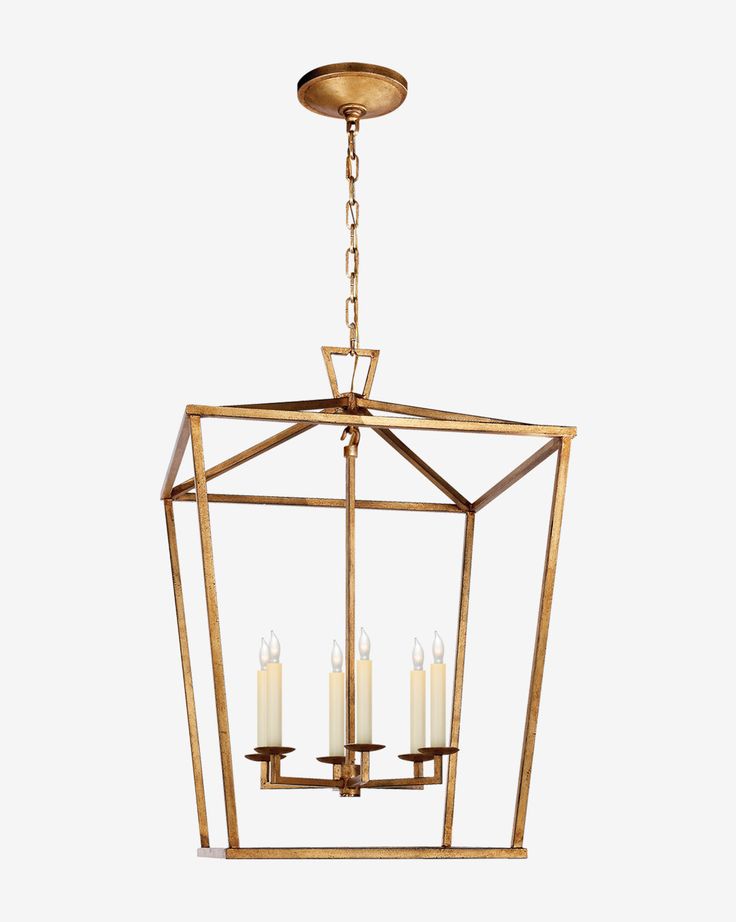 a brass lantern with four candles hanging from the ceiling