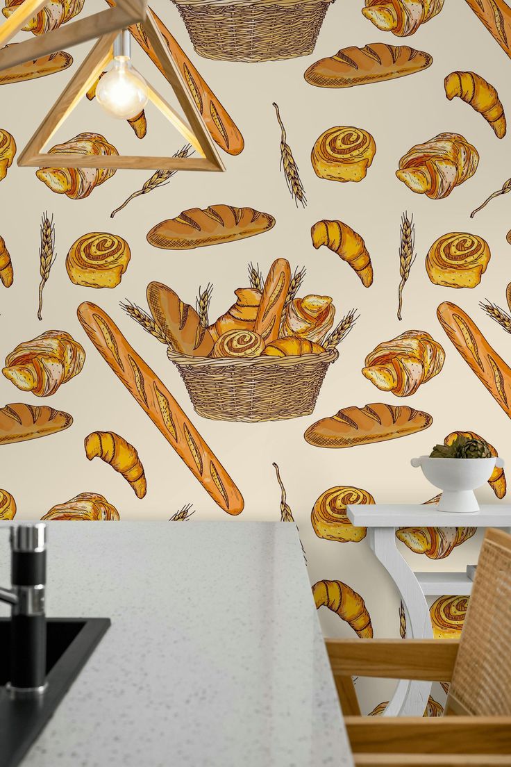 a wallpaper with breads and buns on it in a kitchen area next to a stove