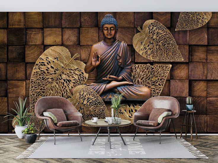 a buddha statue sitting on top of a wooden wall next to two chairs and a table