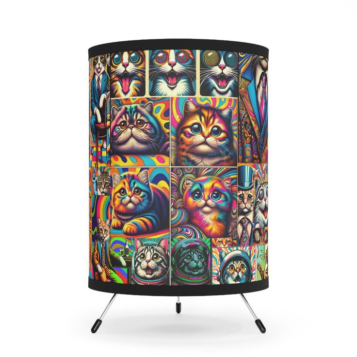 a colorful lamp shade with cats on it's sides and four different colored faces