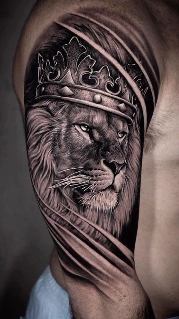 a man's arm with a lion wearing a crown on top of his head