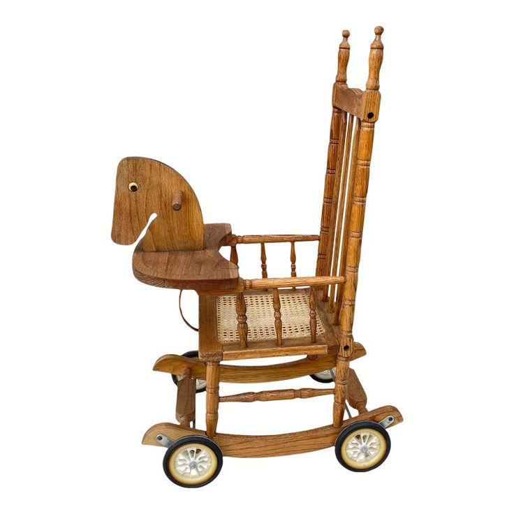 a wooden rocking chair with an elephant shaped seat