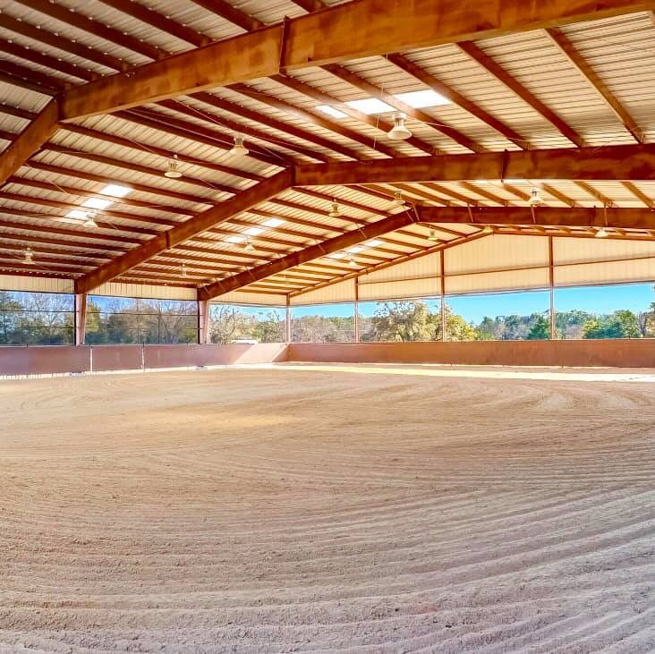 the inside of an empty horse barn with no people on it or horses in the background