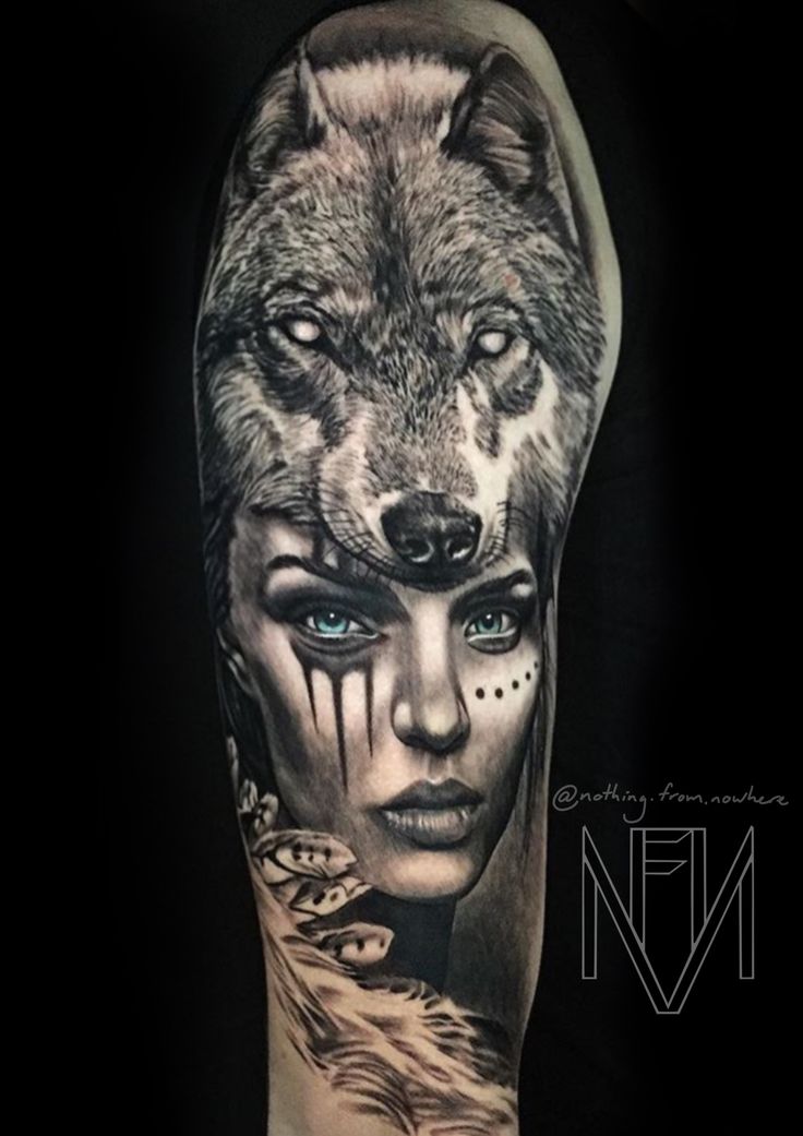 a woman's arm with an image of a wolf and her face on it